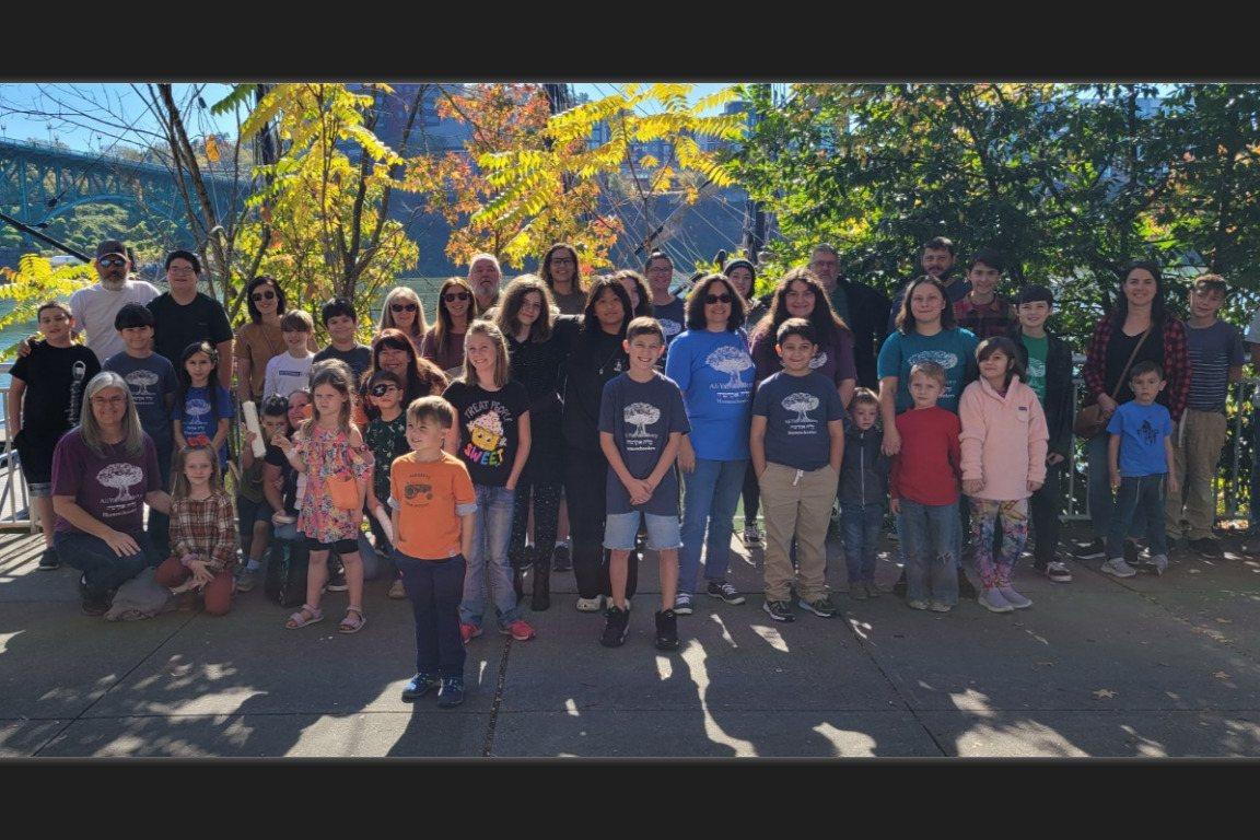 AliYah Academy families gathered for a group photo on a fall outing